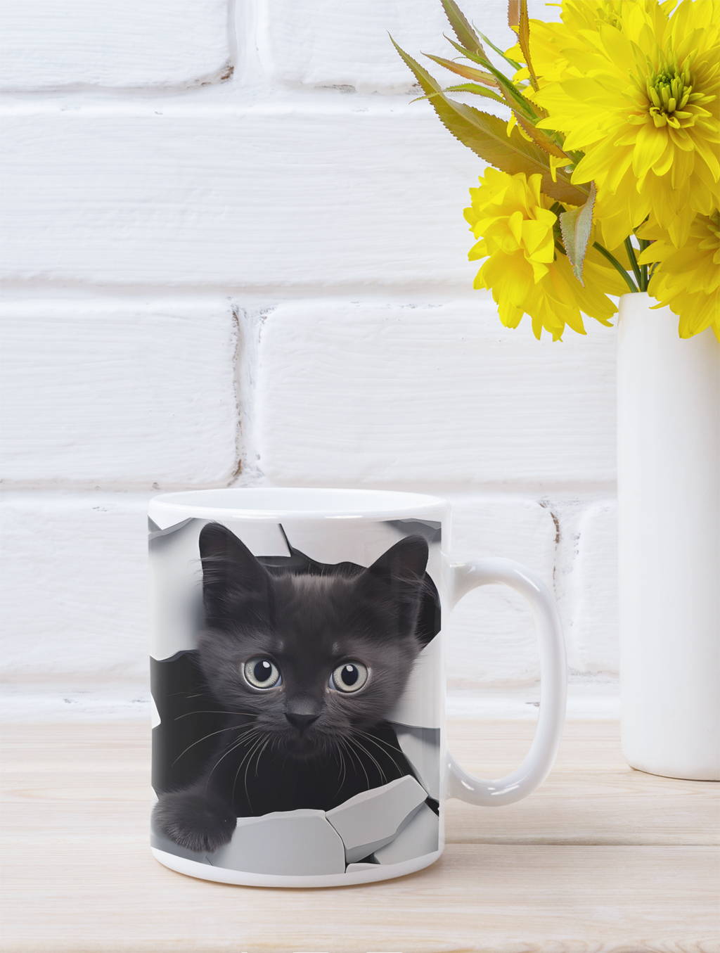 Mug with a black cat design on a white surface with yellow flowers in the background.