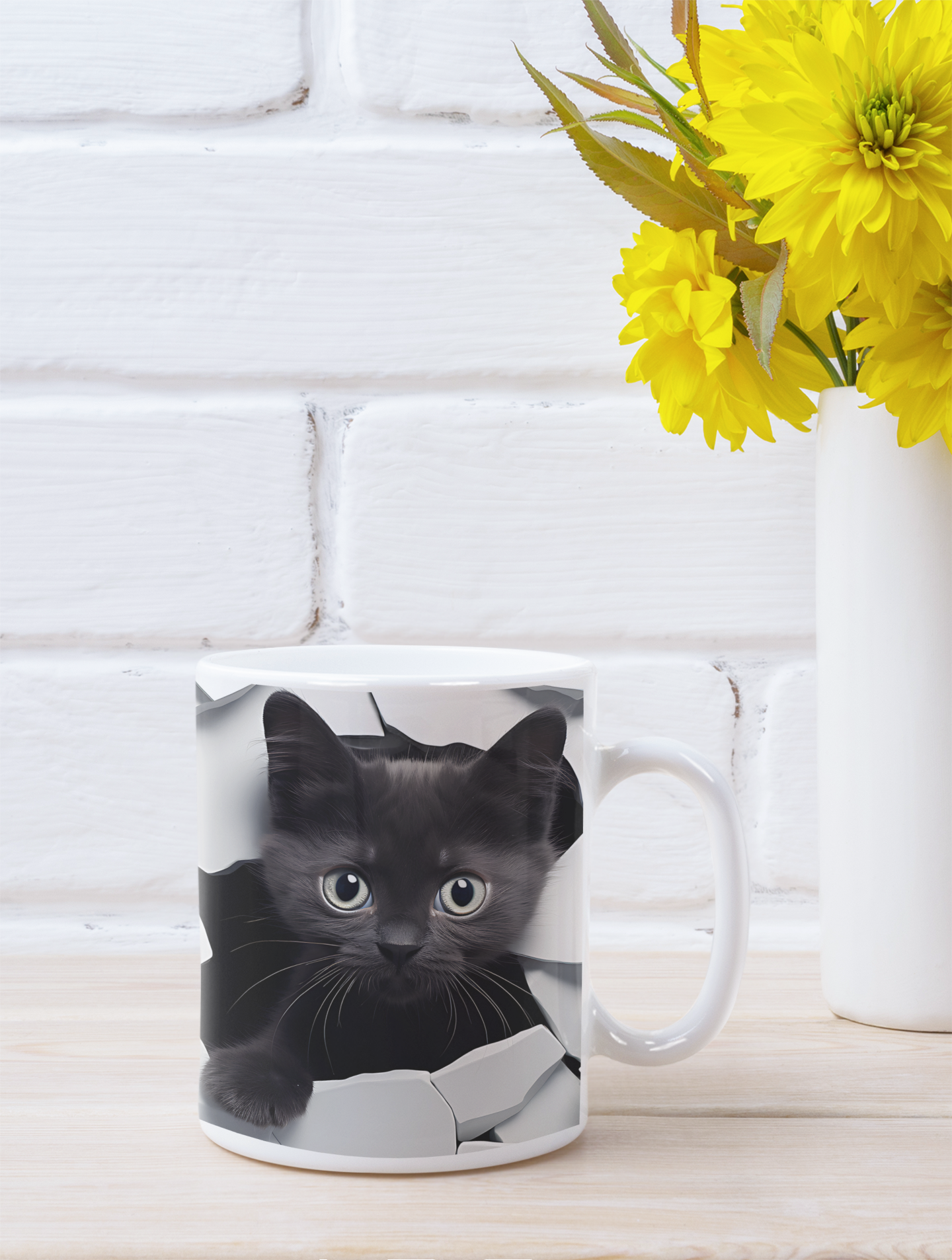 Mug with a black cat design on a white surface with yellow flowers in the background.