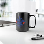 Black mug with 'Top Dad' design on a white surface with office items.