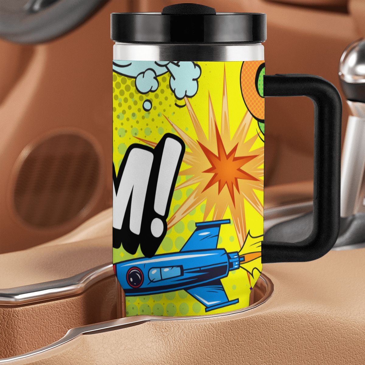 Colorful mug with comic book design featuring a plane and exclamation mark on a car seat background.
