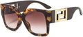 Sunglasses with tortoiseshell frame and gold accents on a white background