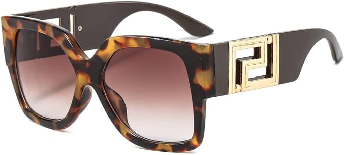 Sunglasses with tortoiseshell frame and gold accents on a white background