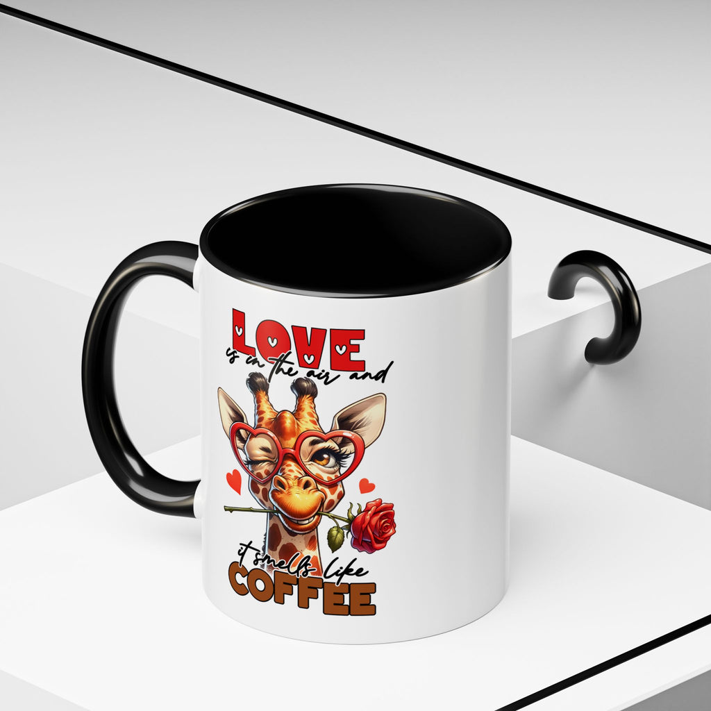 Mug with giraffe design and text 'Love is in the air and it smells like coffee' on a white background