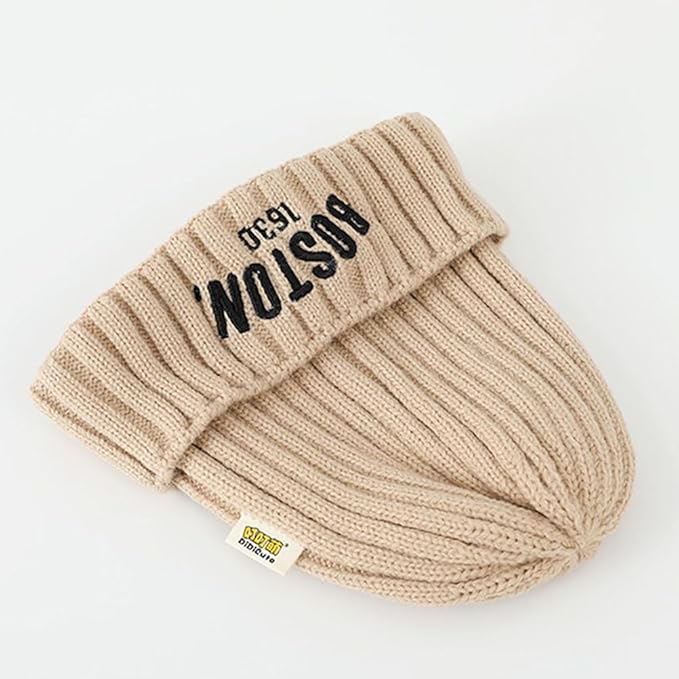 Beige knit beanie with 'Boston' text on a white background