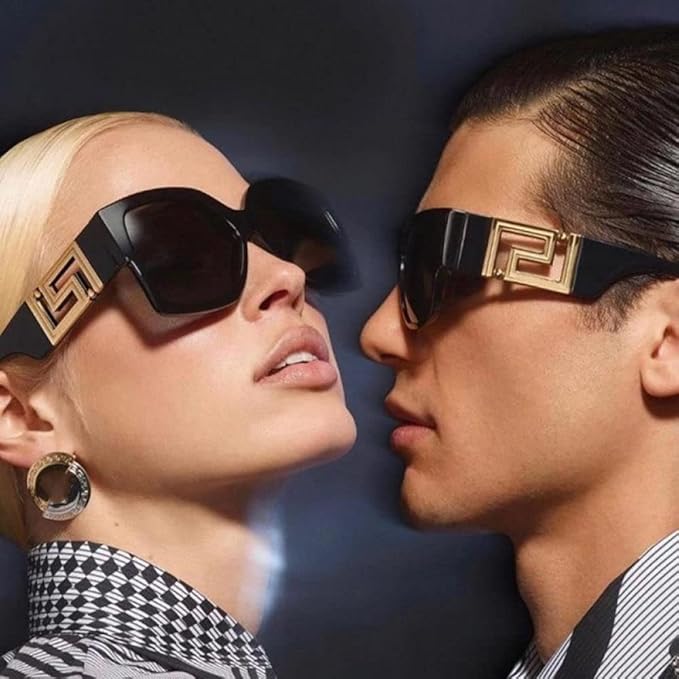 Two people wearing stylish sunglasses with a dark background
