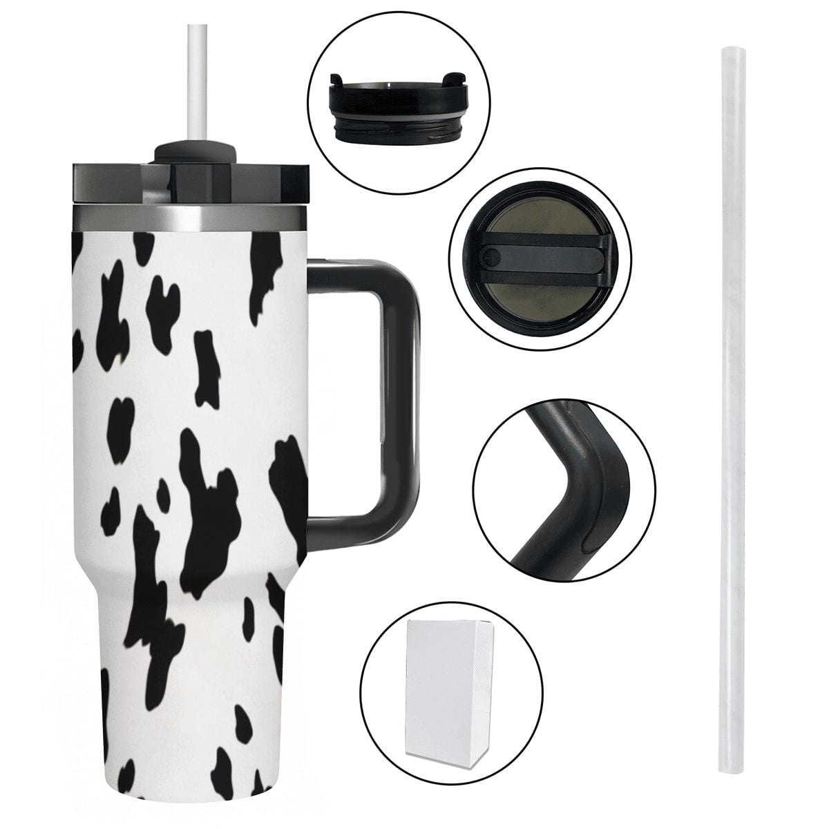 Cow print tumbler with handle and straw on a white background