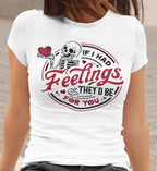 White t-shirt with skeleton design and text on a person wearing it.