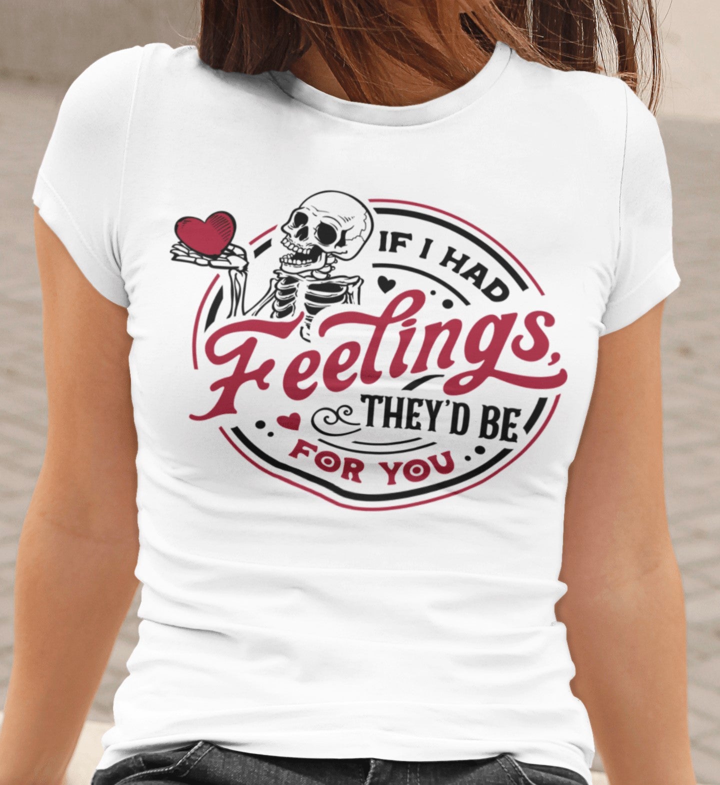 White t-shirt with skeleton design and text on a person wearing it.