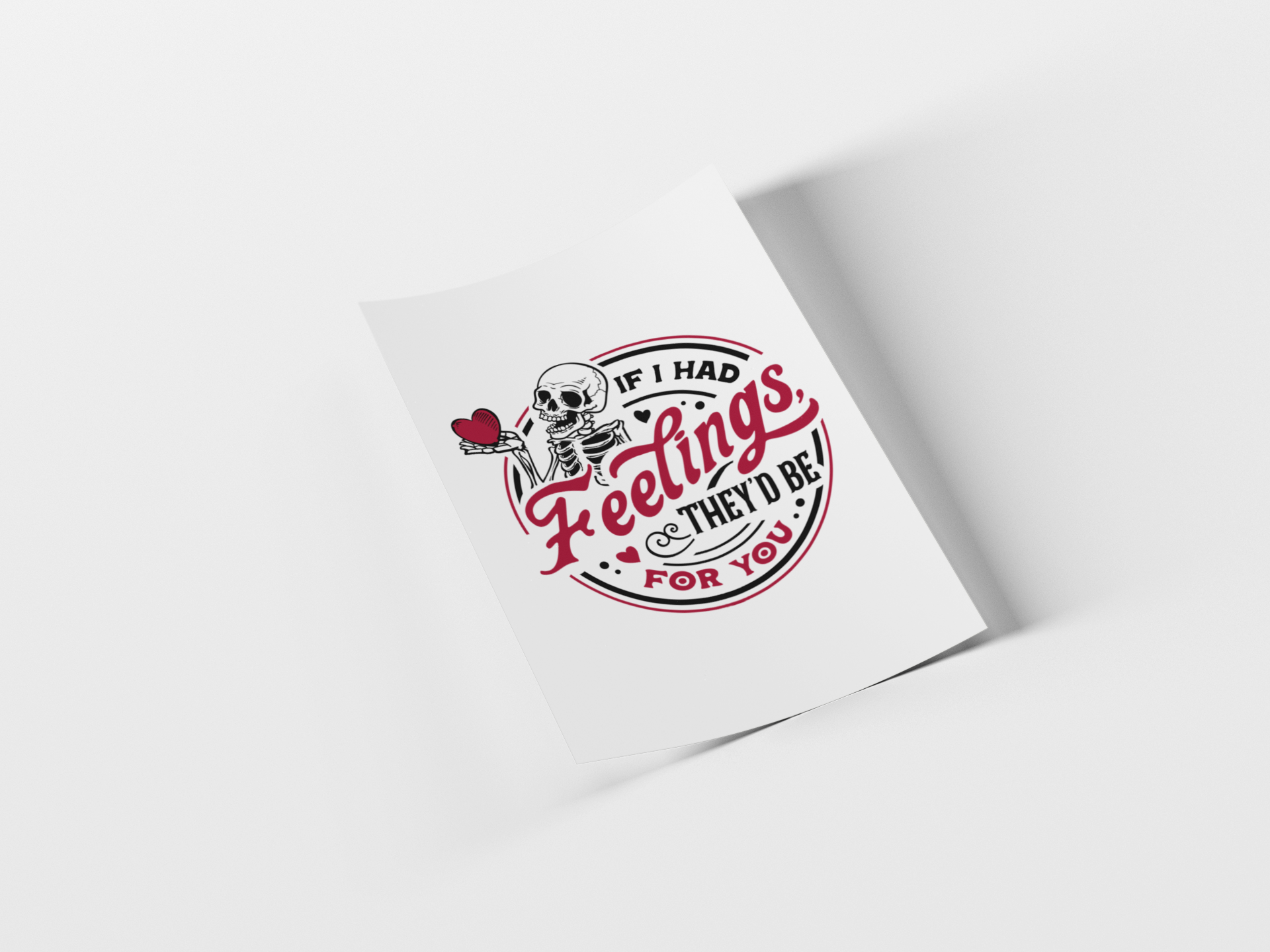 A white square card or print featuring a circular graphic with a cartoon skeleton holding a red heart, surrounded by the text 'IF I HAD Feelings & THEY'D BE! FOR YOU' in red and black, shown on a light gray background with a soft shadow.