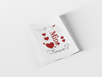 A white greeting card with a romantic Valentine's Day design, featuring the text 'Will You Be Mine Forever?' in gray and red script with red hearts, shown on a clean white background with a soft shadow.