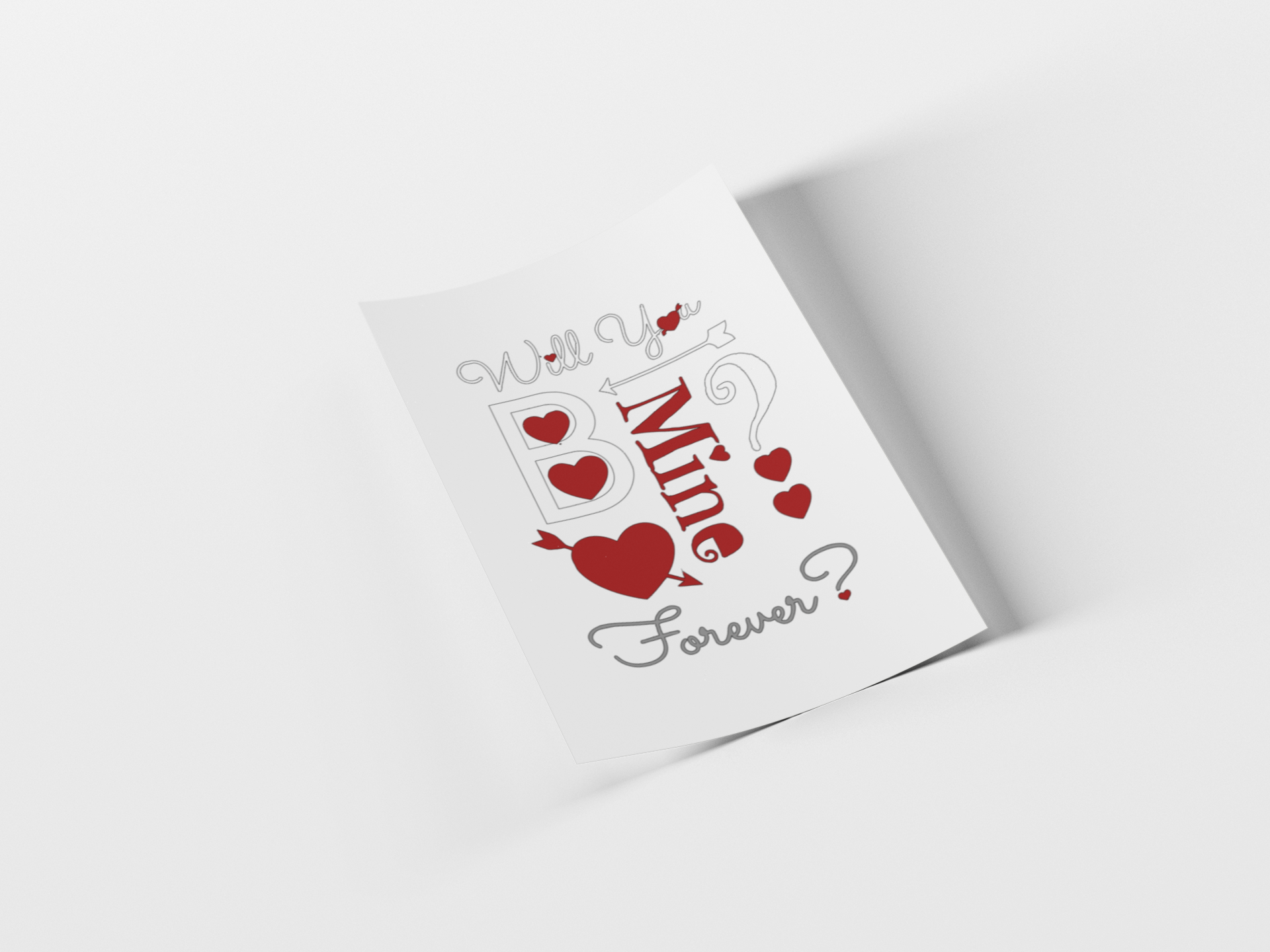 A white greeting card with a romantic Valentine's Day design, featuring the text 'Will You Be Mine Forever?' in gray and red script with red hearts, shown on a clean white background with a soft shadow.