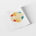 Colorful 'Dada' design on a white card with a gray background