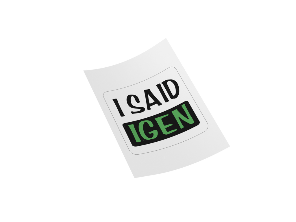 A white rectangular sticker or decal with rounded corners, shown at an angle on a plain white background. The sticker reads 'I SAID IGEN' in black and green text.