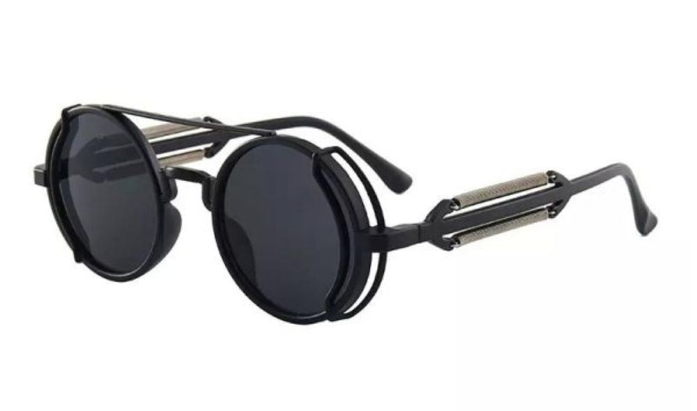 Round sunglasses with black lenses and metallic frame on a white background