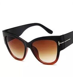 Black cat-eye sunglasses with brown gradient lenses on a white background