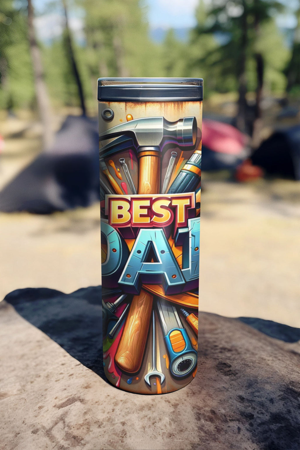 Tumbler with tool design and 'Best Dad' text on a blurred outdoor background