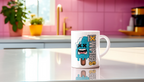 A white ceramic mug with a cartoon graphic of a screaming popsicle and the text 'Scream 13' printed on it, sitting on a reflective white countertop in a brightly lit kitchen with pink tiled walls.