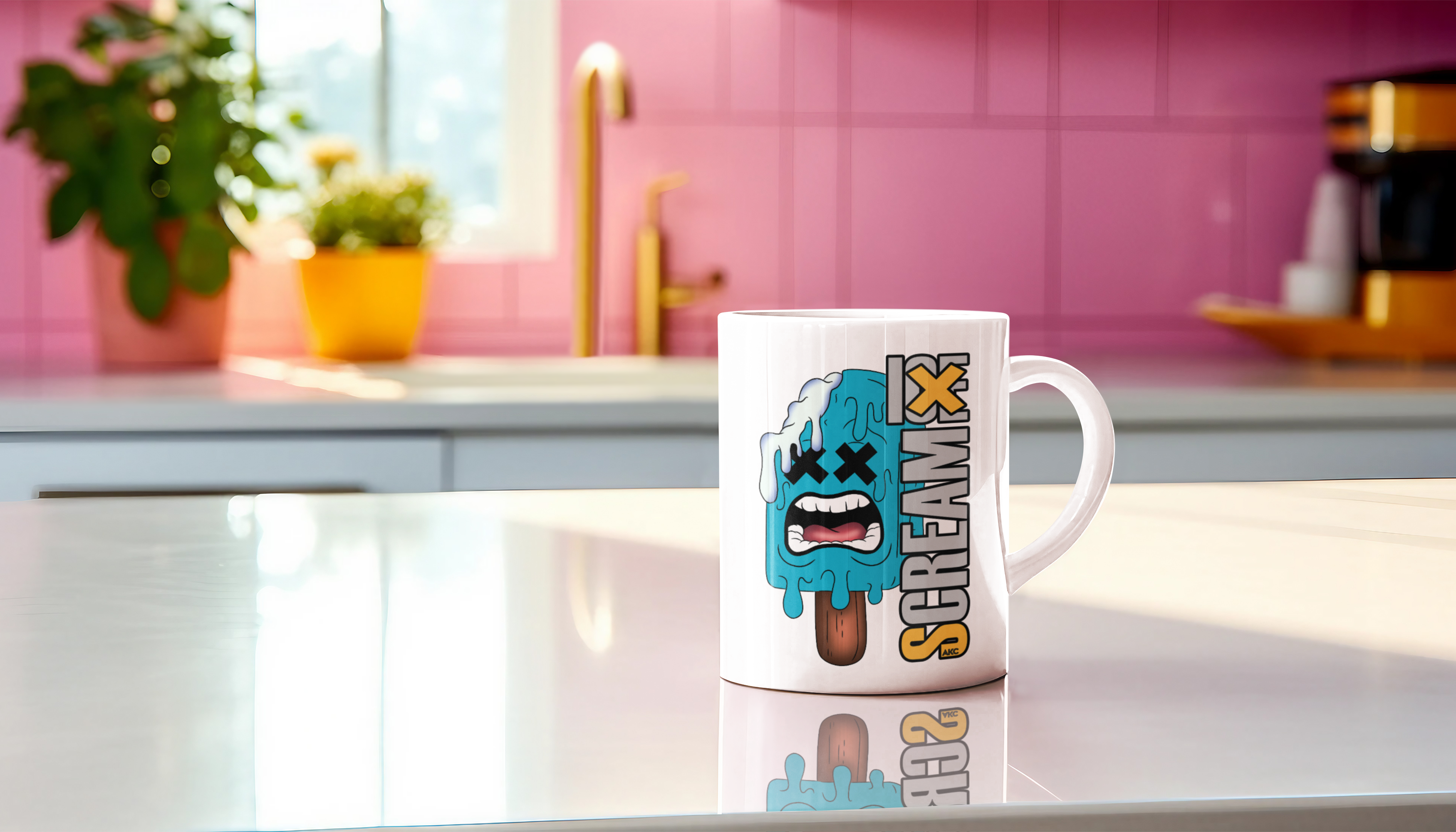 A white ceramic mug with a cartoon graphic of a screaming popsicle and the text 'Scream 13' printed on it, sitting on a reflective white countertop in a brightly lit kitchen with pink tiled walls.