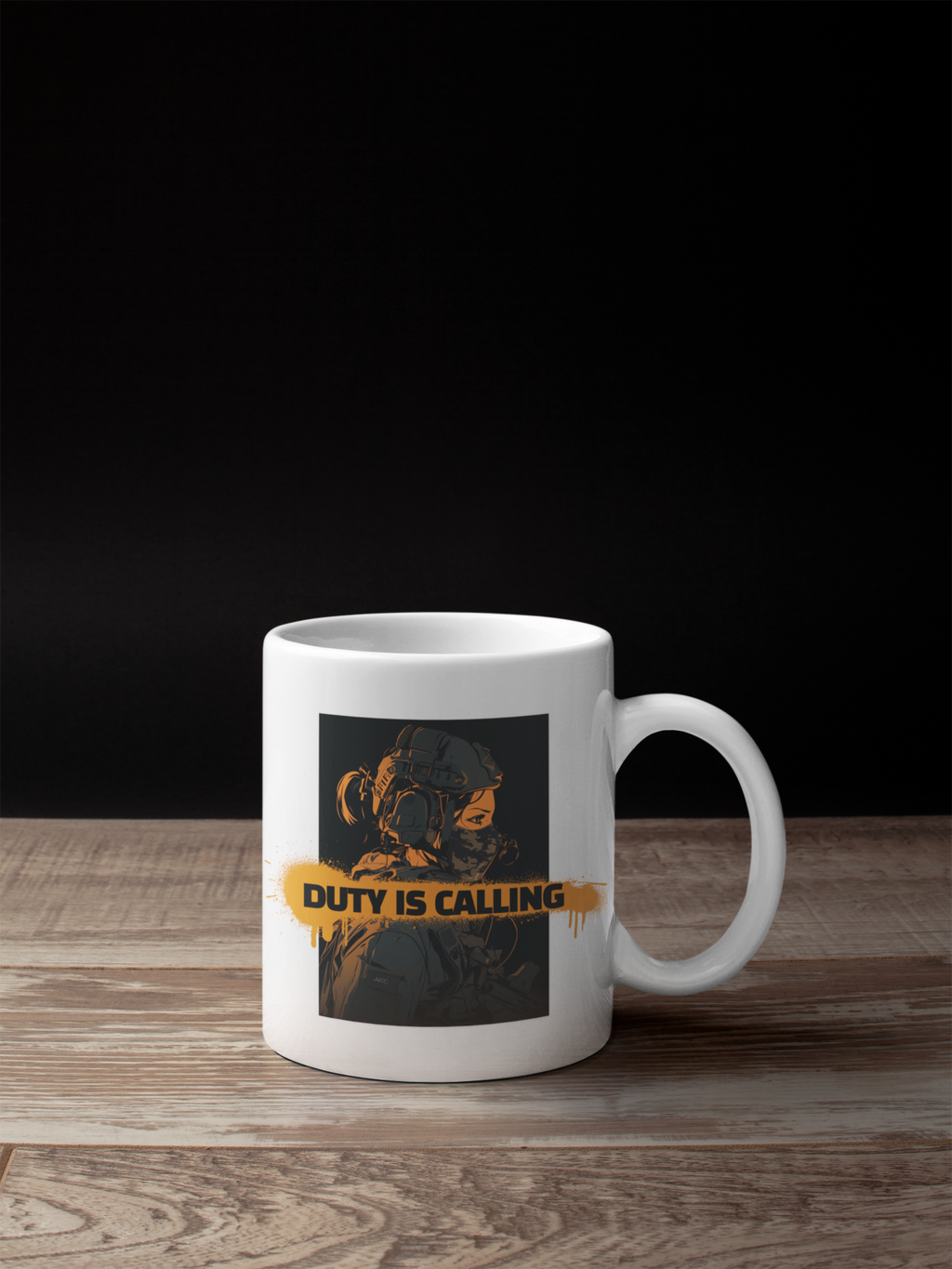 A white ceramic coffee mug with a graphic print of a soldier in a gas mask and the text 'DUTY IS CALLING' in yellow, set on a wooden surface against a black background.