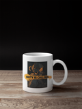 A white ceramic coffee mug with a graphic print of a soldier in a gas mask and the text 'DUTY IS CALLING' in yellow, set on a wooden surface against a black background.