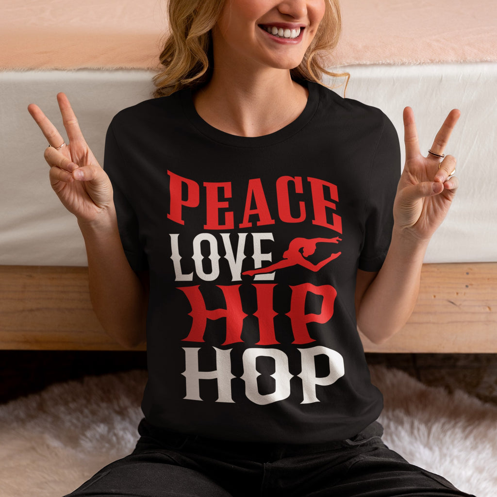 Person wearing a black t-shirt with 'Peace Love Hip Hop' text, making peace signs.