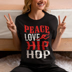 Person wearing a black t-shirt with 'Peace Love Hip Hop' text, making peace signs.