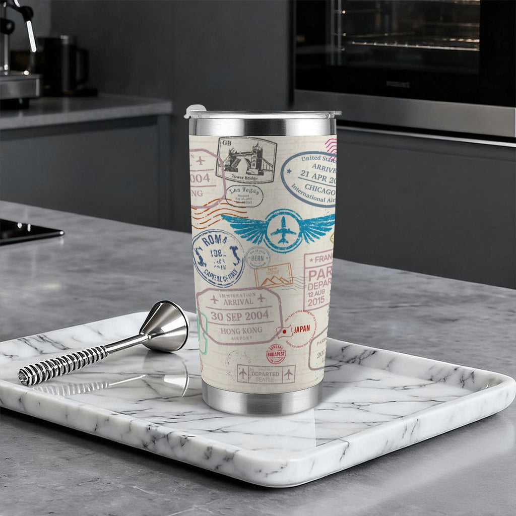 Travel mug with passport design on a marble tray in a kitchen setting