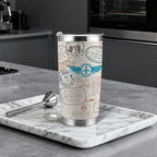 Travel mug with passport design on a marble tray in a kitchen setting