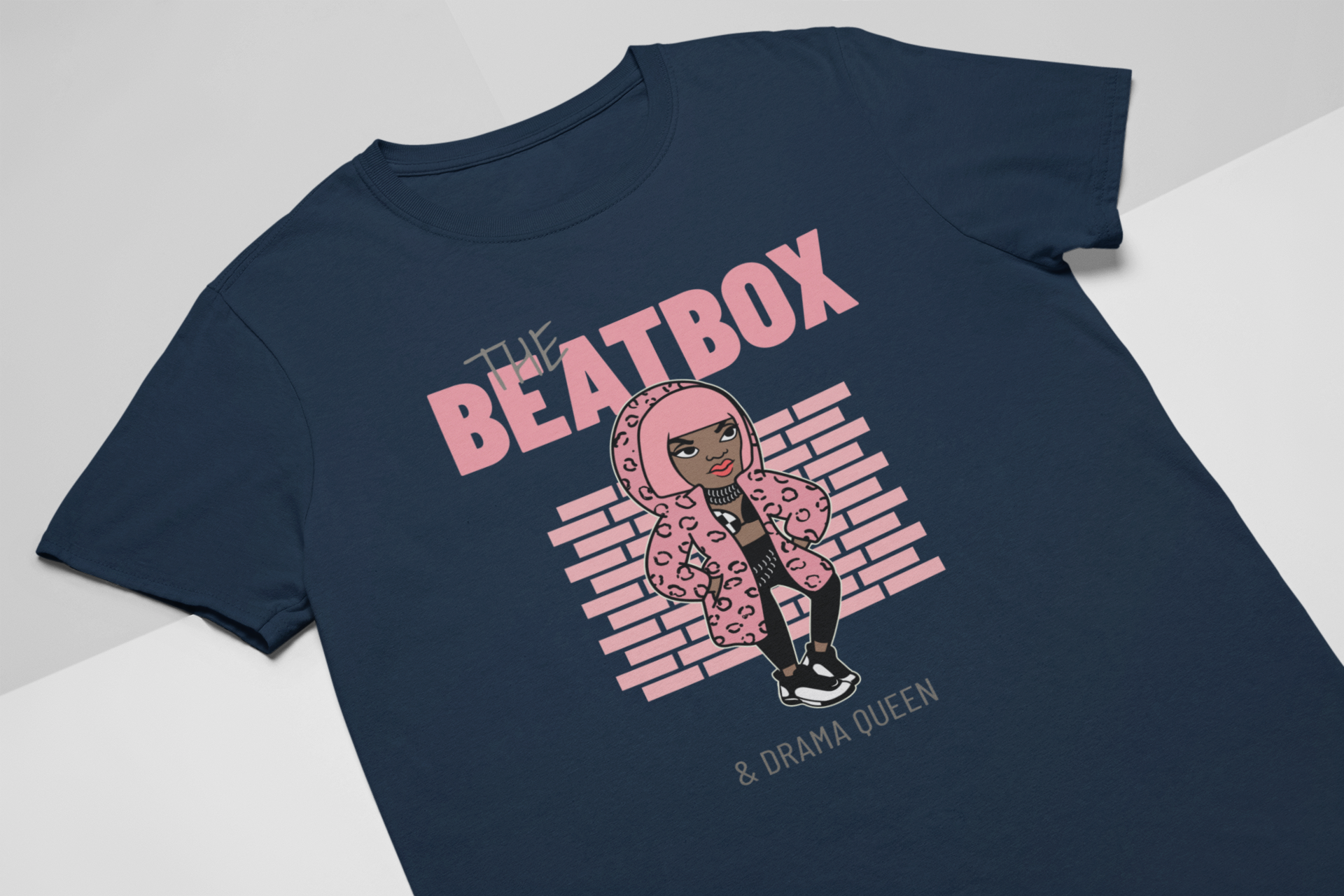Navy blue t-shirt with 'The Beatbox' and 'Drama Queen' text and graphic on a light gray background