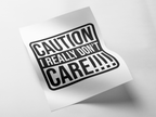 A white rectangular sticker or decal with bold black text reading 'CAUTION REALLY DON'T CARE!!!!' shown on a light gray background with a soft shadow.