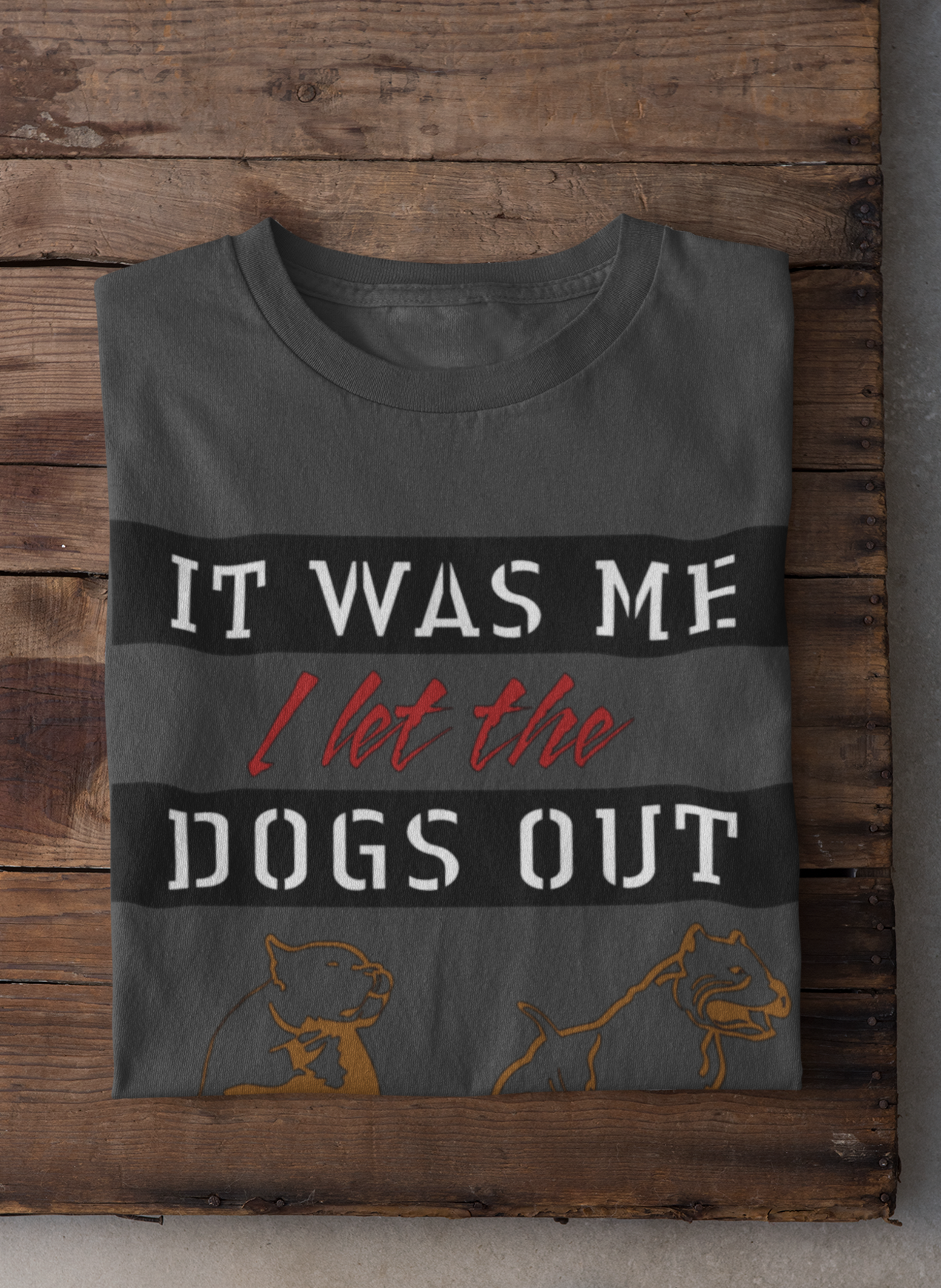 Gray t-shirt with humorous text design on a wooden surface