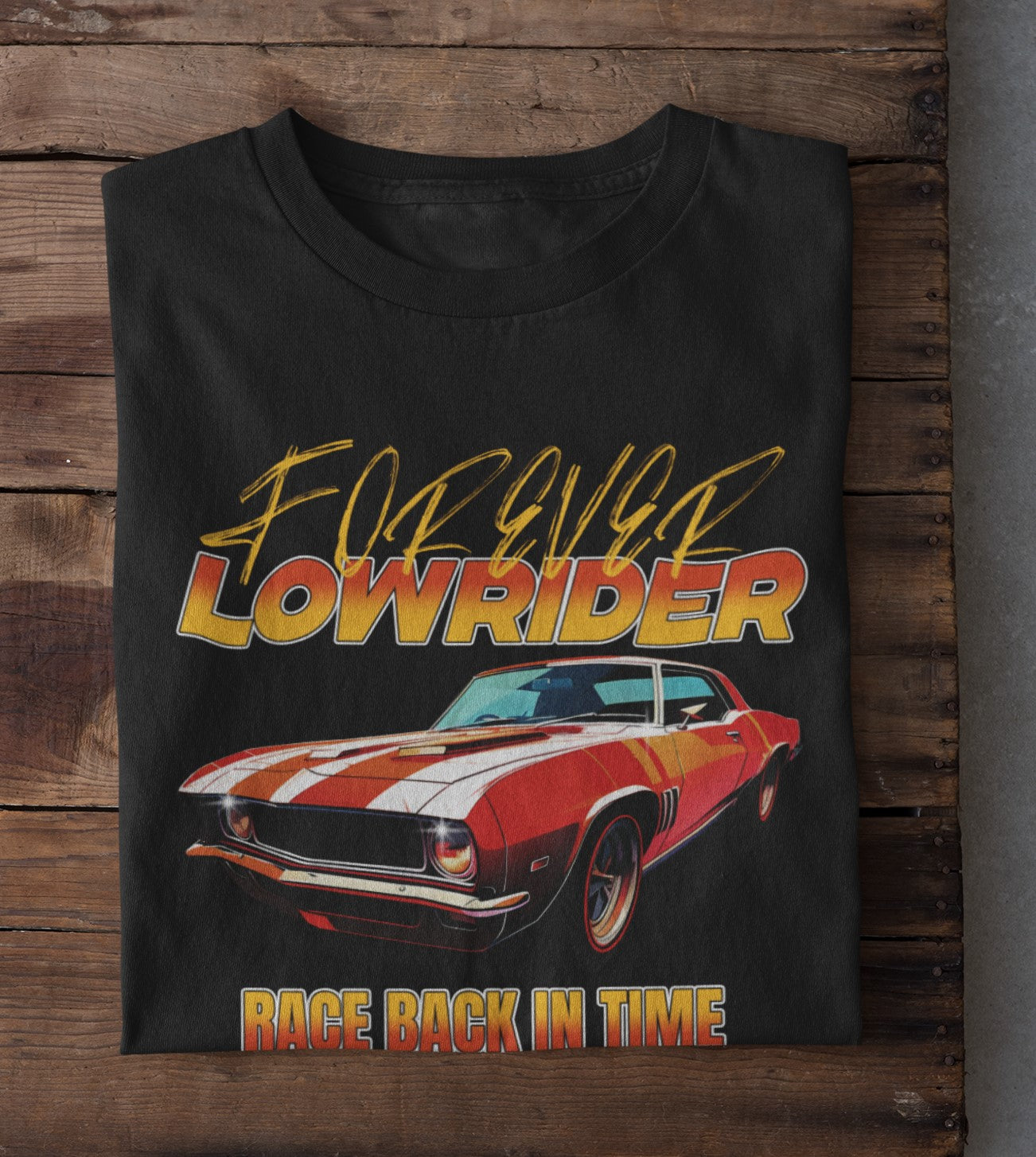 Black t-shirt with a red and white car graphic and 'Forever Lowrider' text on a wooden surface