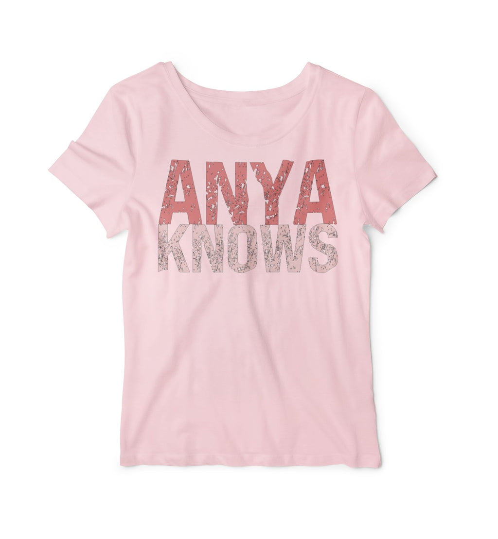 Pink t-shirt with 'ANYA KNOWS' text on a white background