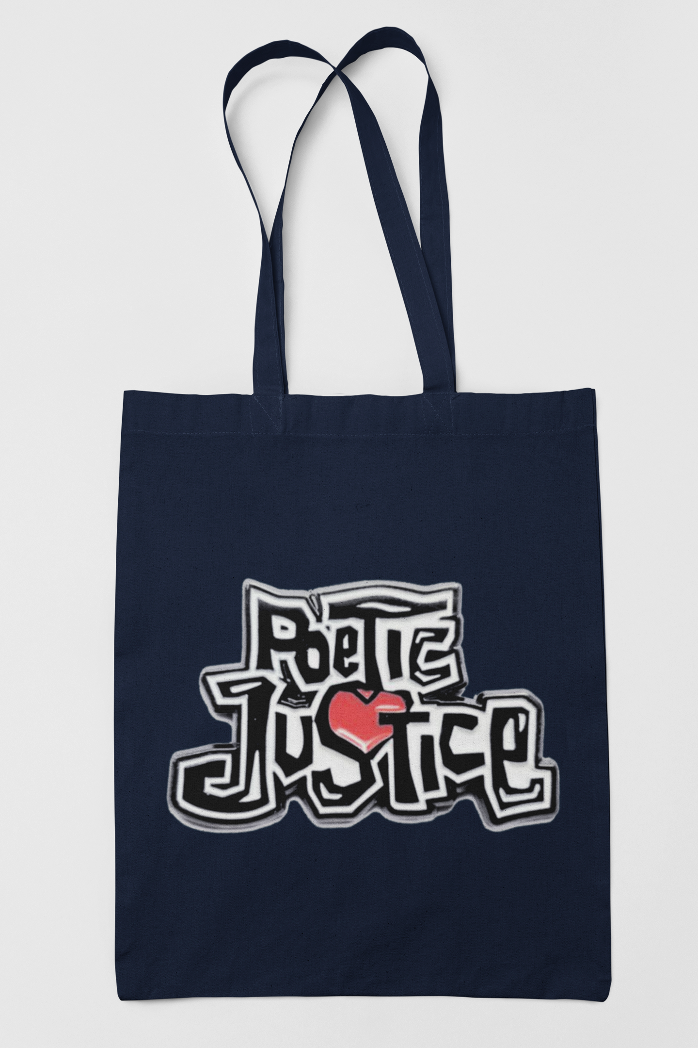 Navy blue tote bag with 'Poetic Justice' design on a light gray background