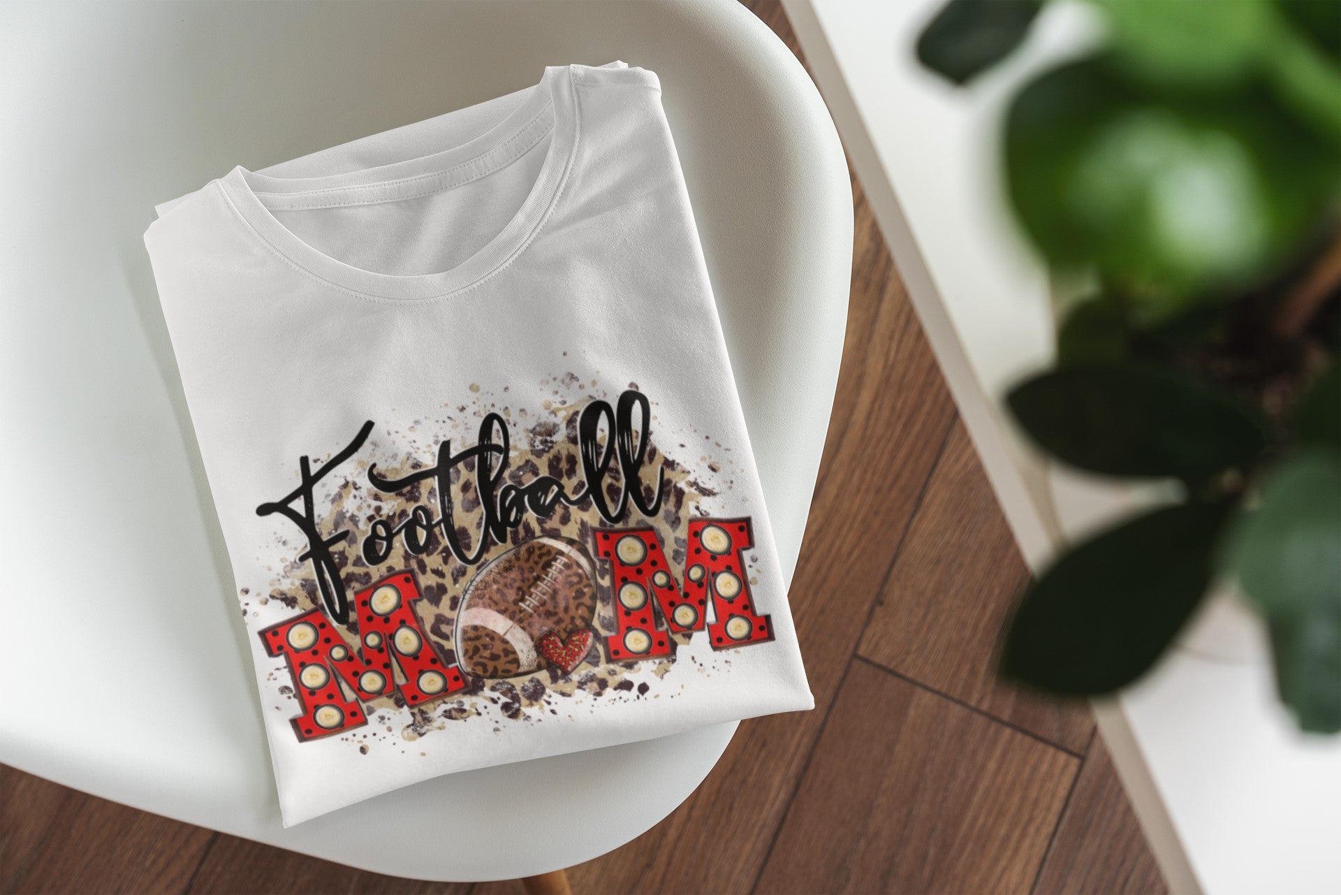 White t-shirt with colorful design on a white surface