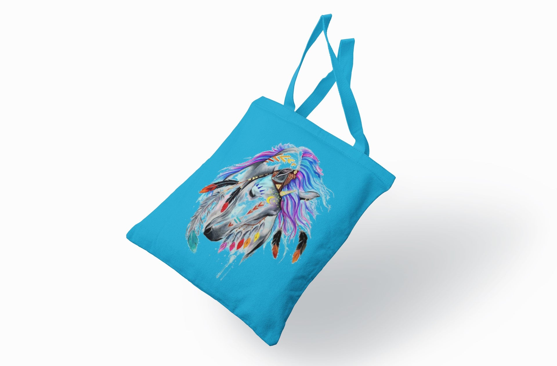 Blue tote bag with a colorful feather design on a white background