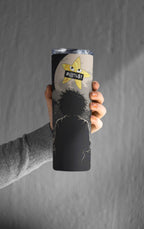 Person holding a tumbler with a graphic design on a gray background
