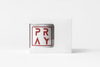 White card with red 'PRAY' text on a white background
