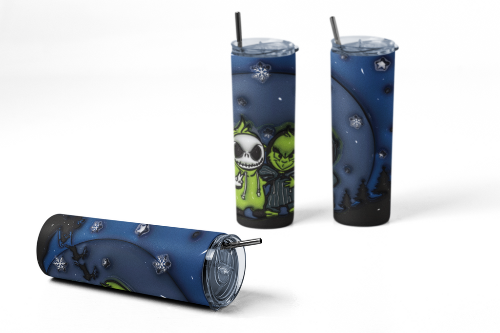 A tall insulated tumbler with a clear lid and metal straw, shown from multiple angles on a white background. The tumbler has a dark blue and black night-sky style print with white snowflakes and a green cartoon character illustration.