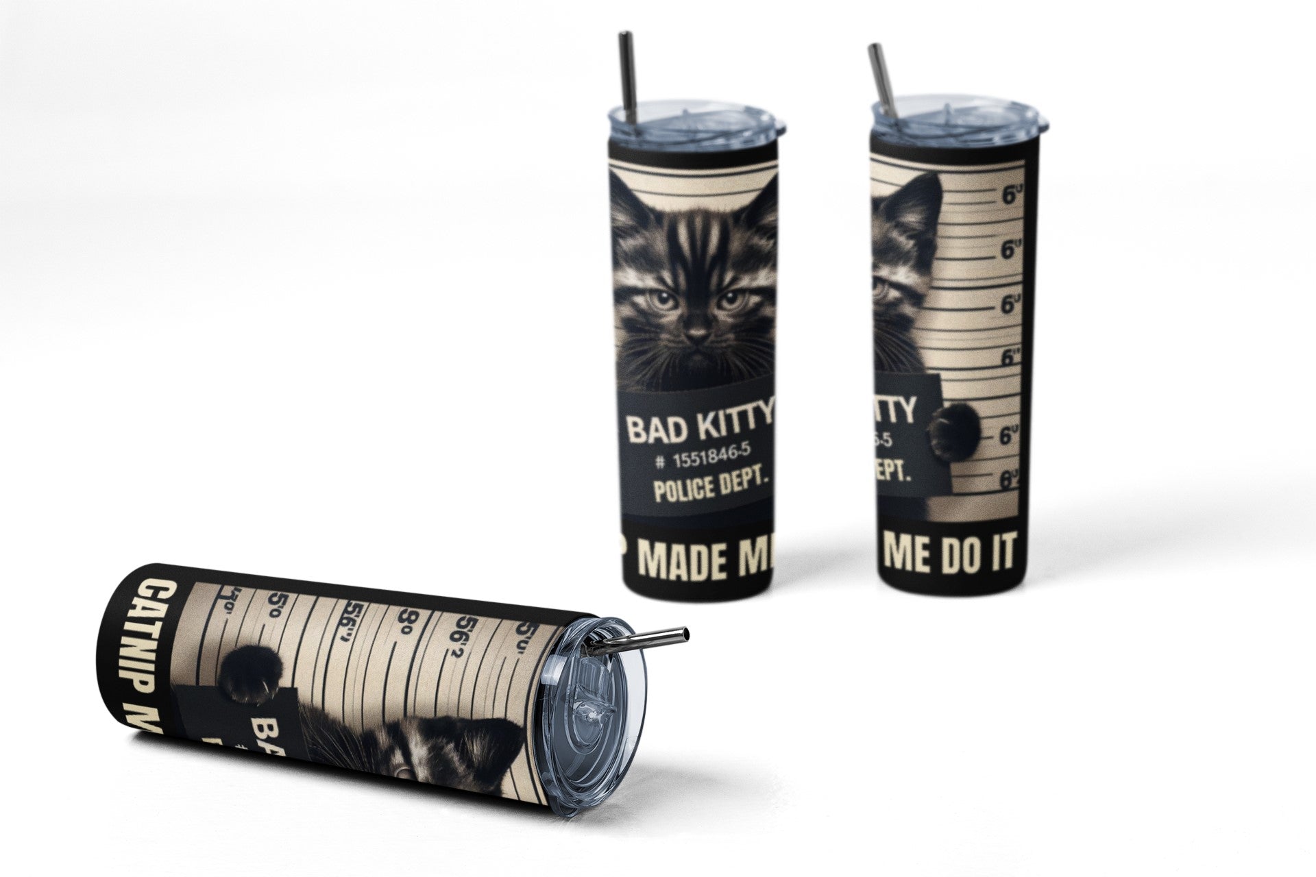 Three tumblers with cat-themed designs and text on a white background