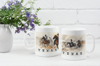 Two white ceramic mugs with a western Texas cowboy and horse print, displayed on a white surface next to a white vase with purple flowers against a white brick wall.