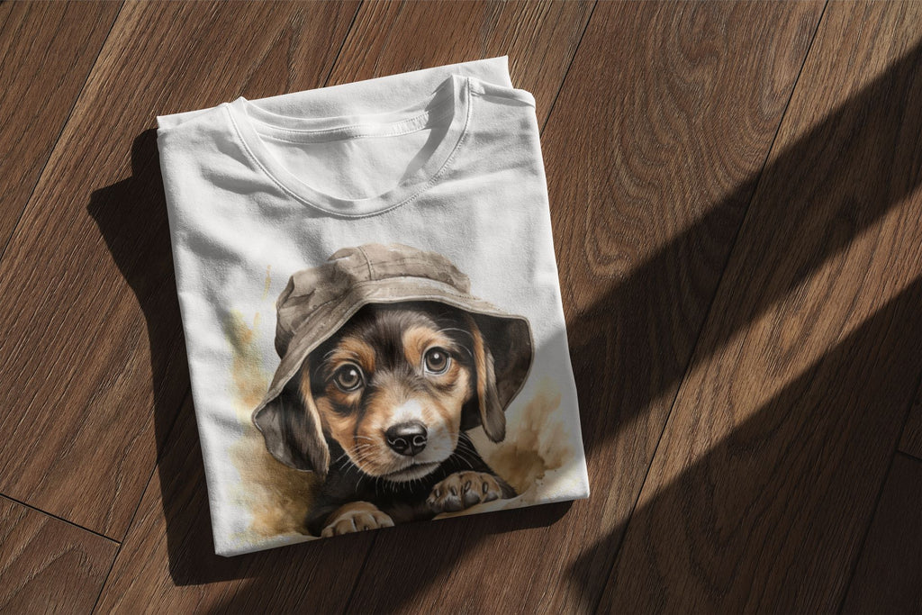 Folded t-shirt with a puppy wearing a hat design on a wooden surface