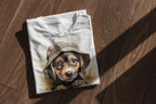 Folded t-shirt with a puppy wearing a hat design on a wooden surface
