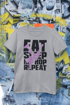 Gray t-shirt with 'Eat Sleep Hip Hop Repeat' text on a graffiti-style background