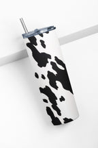 Tumbler with cow print design on a white background