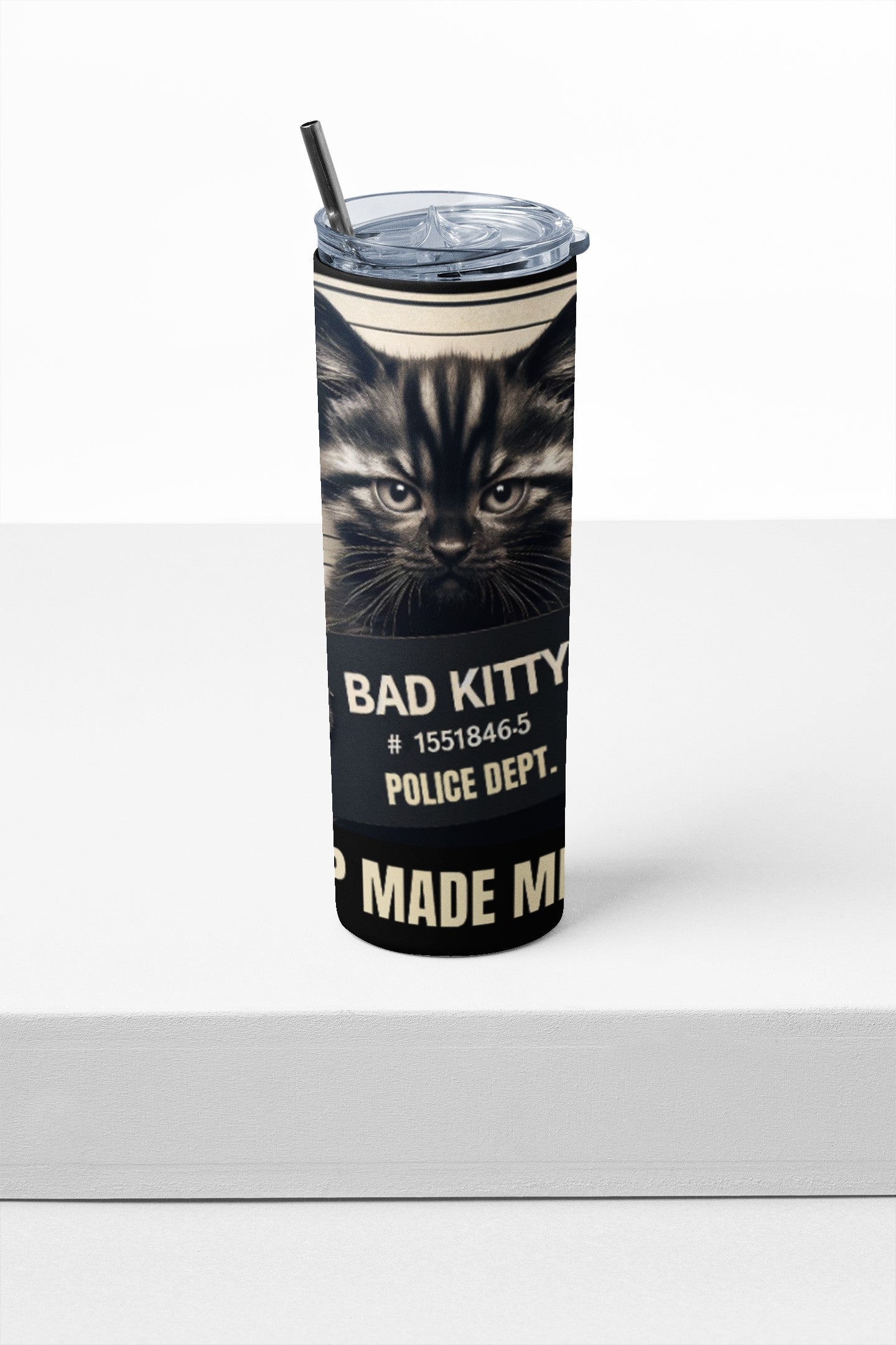 Tumbler with a cat design and text on a white background