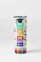 Tumbler with colorful text 'Teacher Life' and a graduation cap, surrounded by colored pencils on a white background.