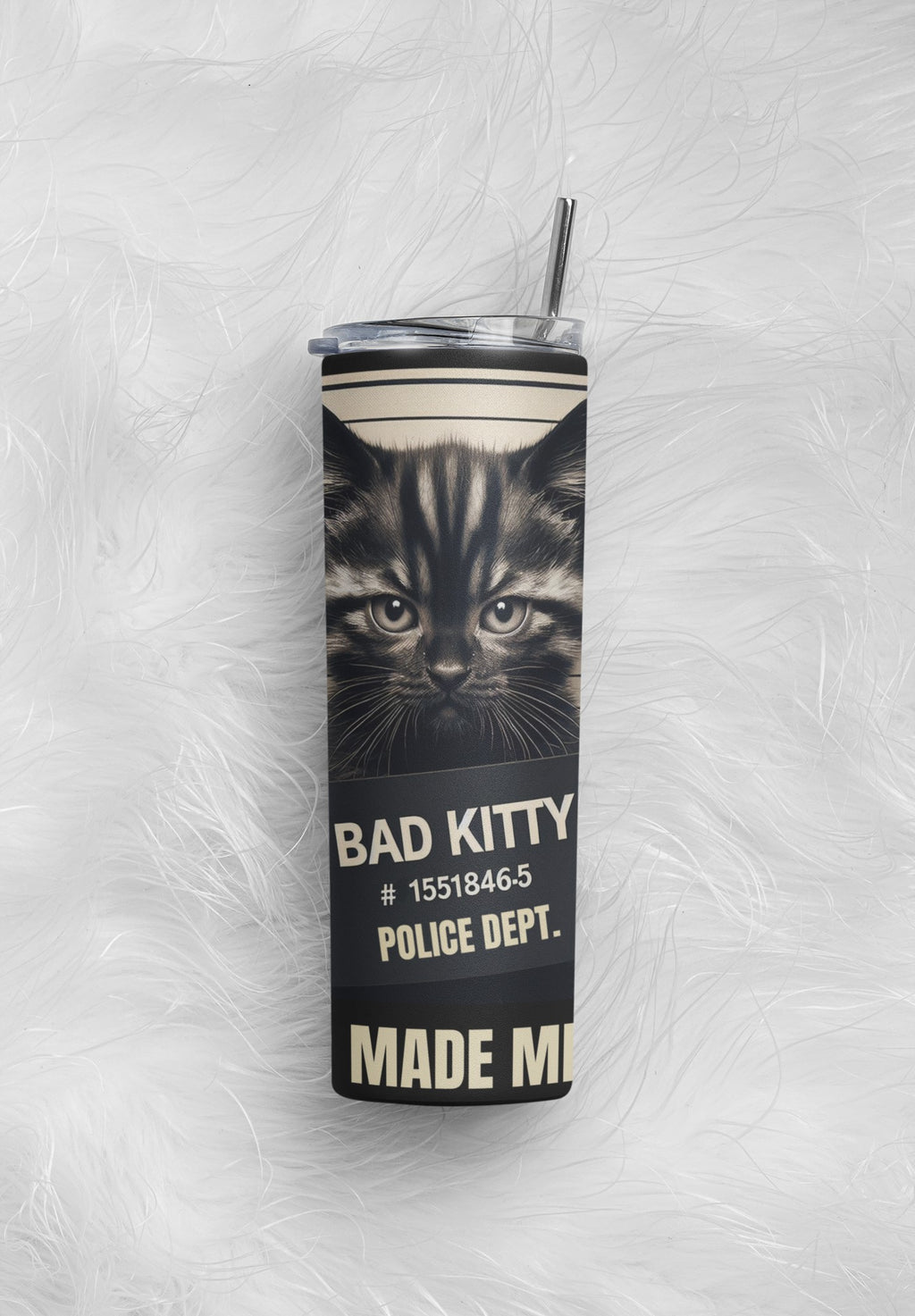 Tumbler with a cat design and text on a textured white background