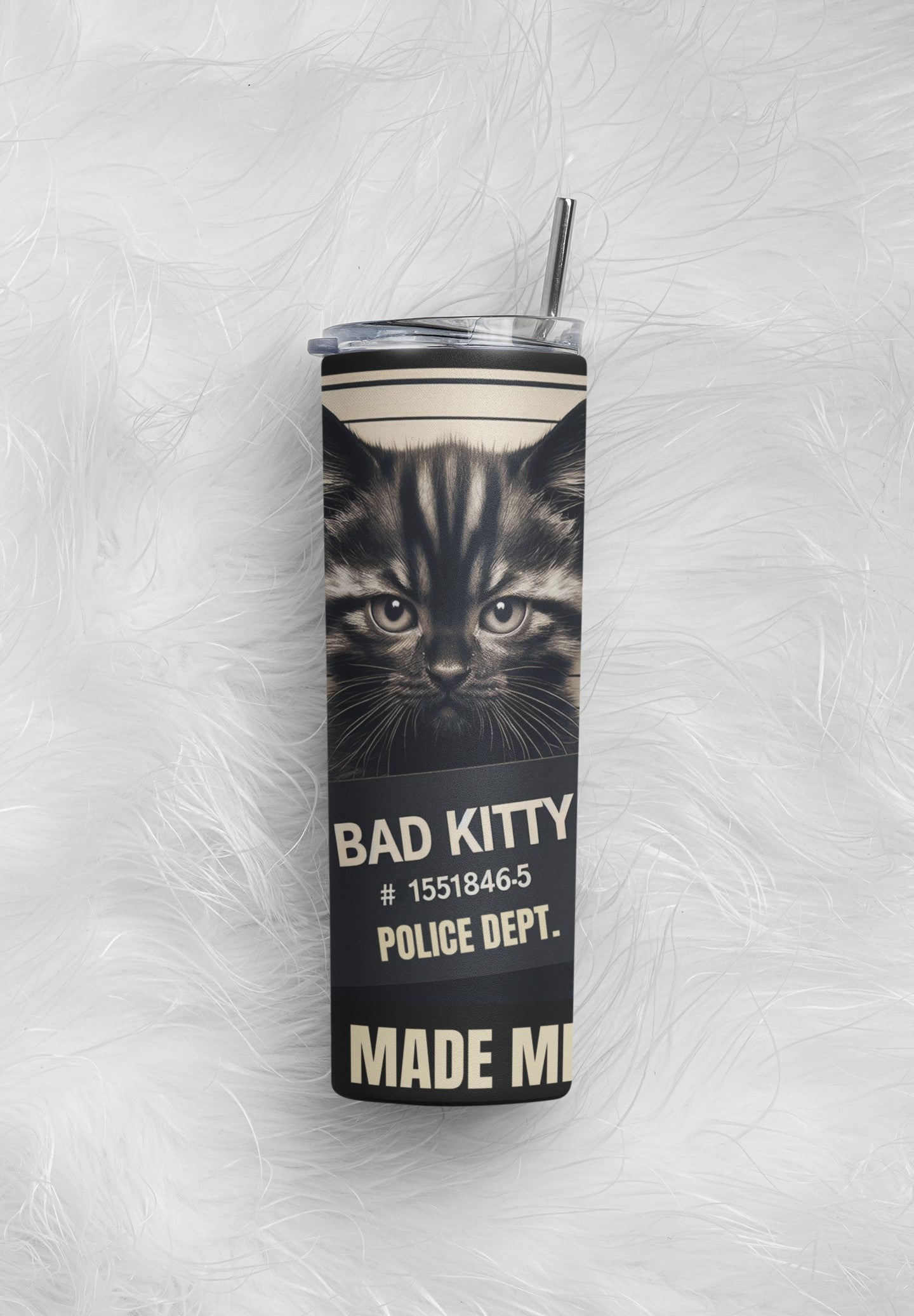 Tumbler with a cat design and text on a textured white background