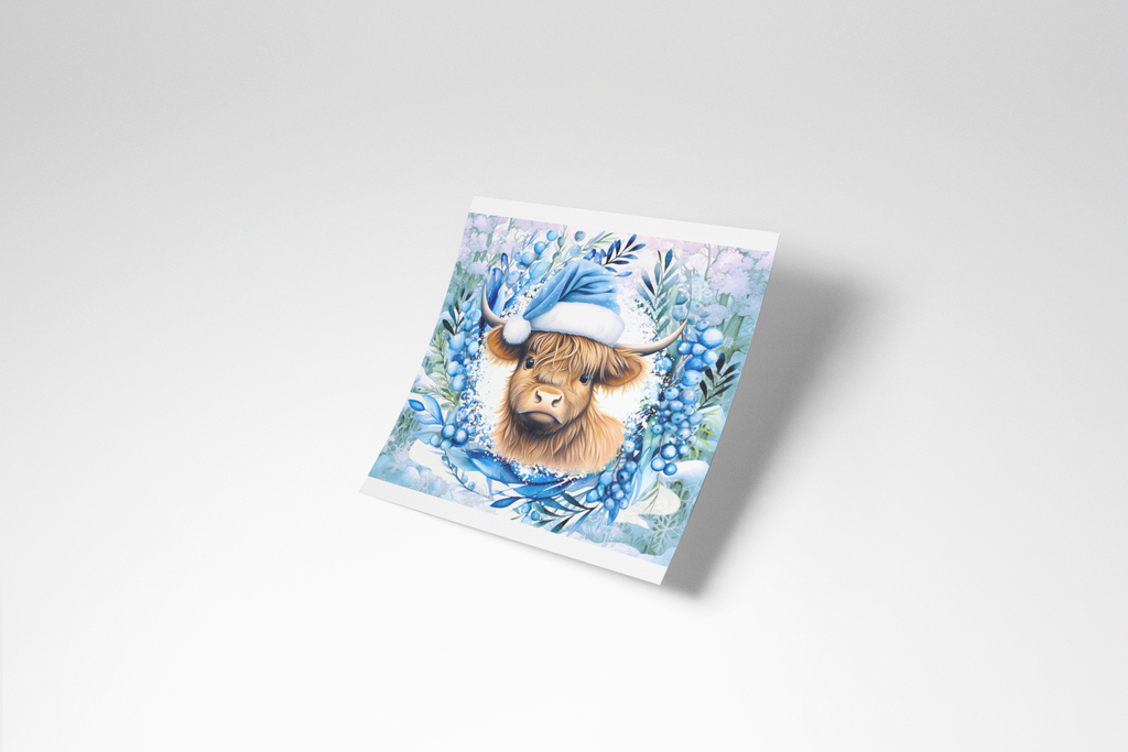 Notebook with a highland cow illustration wearing a blue hat on a white background